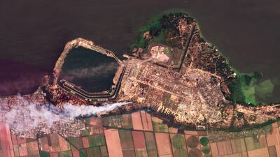 A composite of satellite images shows smoke rising from fires at the Zaporizhzhia nuclear power plant in south-eastern Ukraine on August  24, 2022. Planet Labs PBC via AP