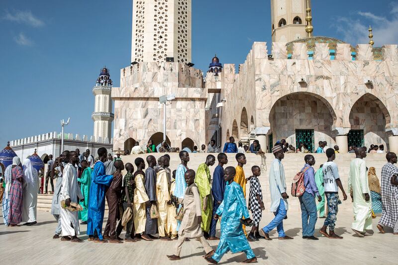 Pilgrims of the Mouride Brotherhood wait to enter the Grand Mosque during the Grand Magal of Touba annual pilgrimage in Senegal. AFP
