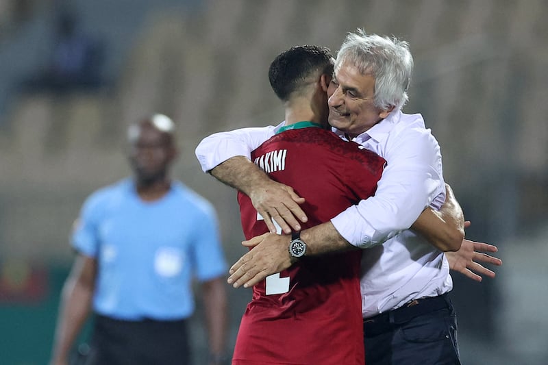 Morocco defender Achraf Hakimi celebrates with Morocco's head coach Vahid Halilhodzic after scoring his team's second goal. AFP
