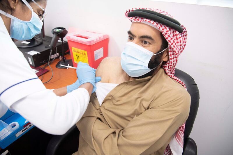 Abdullah Al Falasi, director general of Dubai Government Human Resources Department, receives his first dose of the Pfizer-BioNTech vaccine. Courtesy: Dubai Media Office