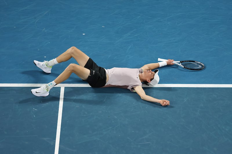 Jannik Sinner collapses after clinching championship point. Getty Images