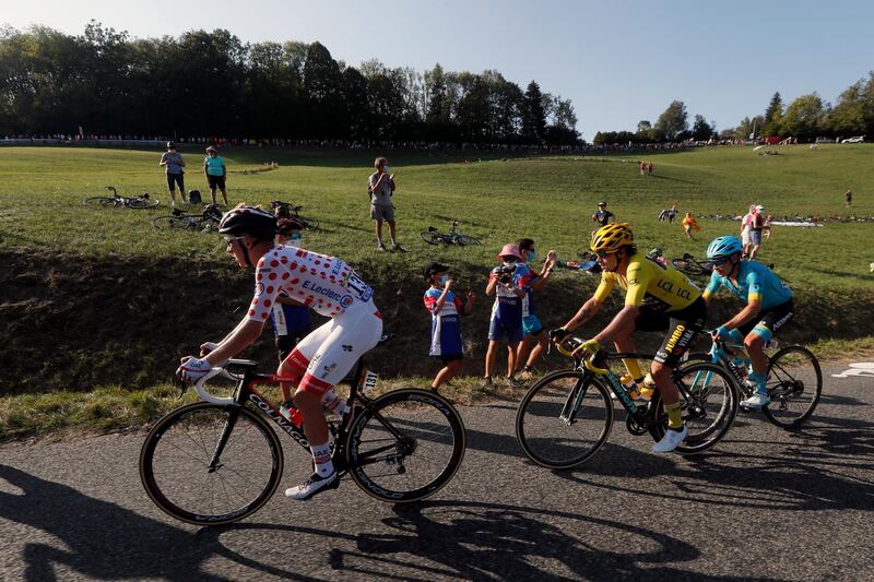 Slovenia's Primoz Roglic, wearing the overall leader's yellow jersey and Slovenia's Tadej Pogacar climb Plateau des Glieres during the stage 18 of the Tour de France cycling race over 175 kilometers (108.7 miles) from Meribel to La Roche-sur-Foron, France, Thursday, Sept. 17, 2020. (AP Photo/Thibault Camus)