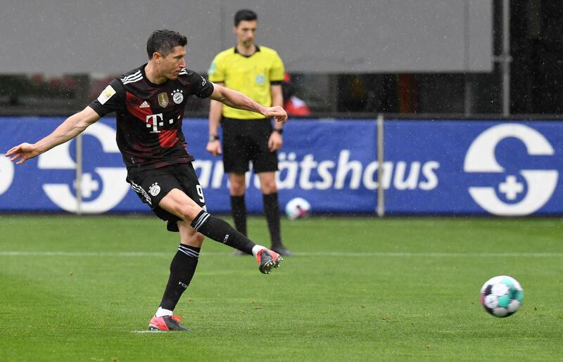 Bayern forward Robert Lewandowski scores the opening goal from the penalty spot in their 2-2 draw at Freiburg. The striker has now scored 40 goals in 28 league games this season. AFP