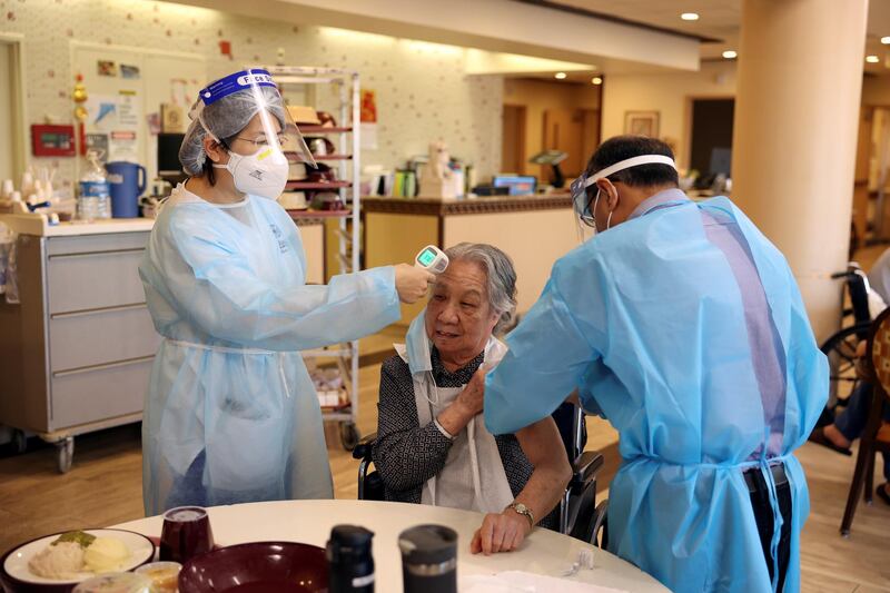 A resident receives the coronavirus vaccine at Hamilton Park Nursing and Rehabilitation, a nursing home facility in Brooklyn, New York. Yuki Iwamura / Reuters