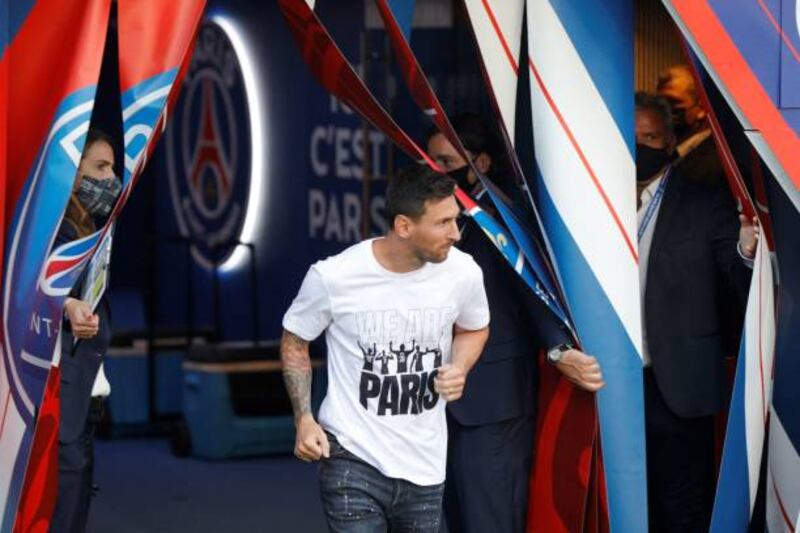 Paris Saint-Germain's Argentinian forward Lionel Messi enters the pitch during a presentation ceremony prior to the French L1 football match between Paris Saint-Germain and Racing Club Strasbourg at the Parc des Princes stadium in Paris.