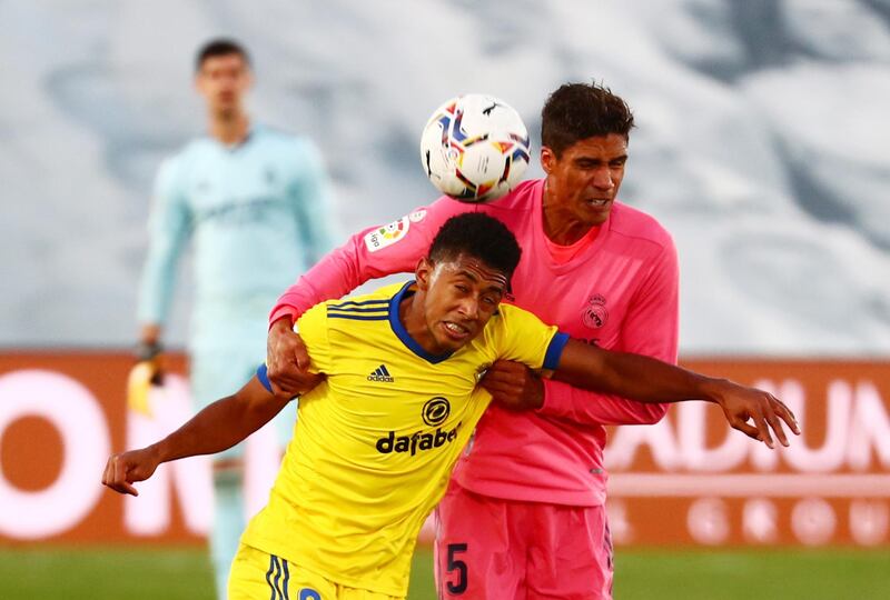 Real Madrid's Raphael Varane in action with Cadiz's Anthony Lozano. Reuters