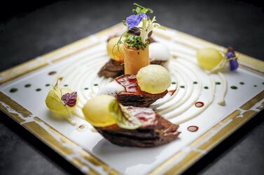 Black Angus steak with potatoes and aubergine. Courtesy L’Atelier de Joel Robuchon