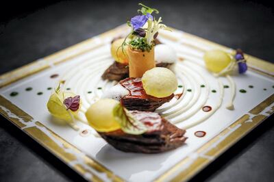 Black Angus steak with potatoes and aubergine at L’Atelier de Joel Robuchon. Courtesy L’Atelier de Joel Robuchon