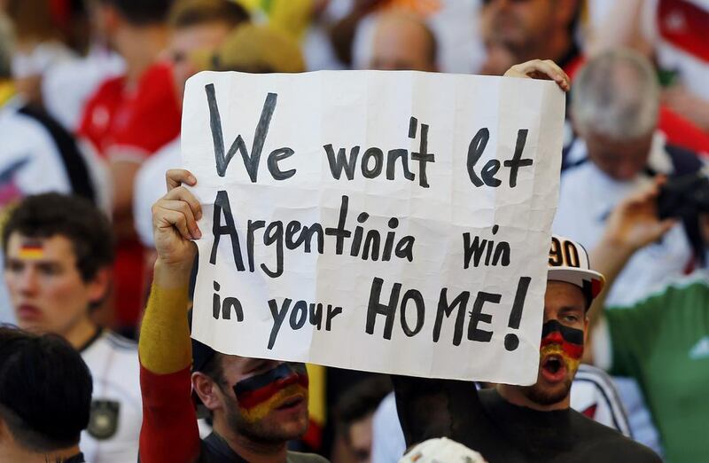 A fan of Germany holds up a placard as he waits for the start of the final. Darren Staples / Reuters