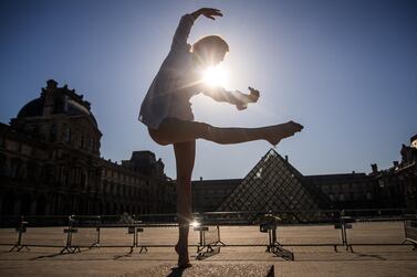 Syrian dancer and choreographer Yara al-Hasbani performs a dance in front of the Louvre museum's pyramid in Paris on the 37th day of a strict lockdown in France to stop the spread of Covid-19. AFP