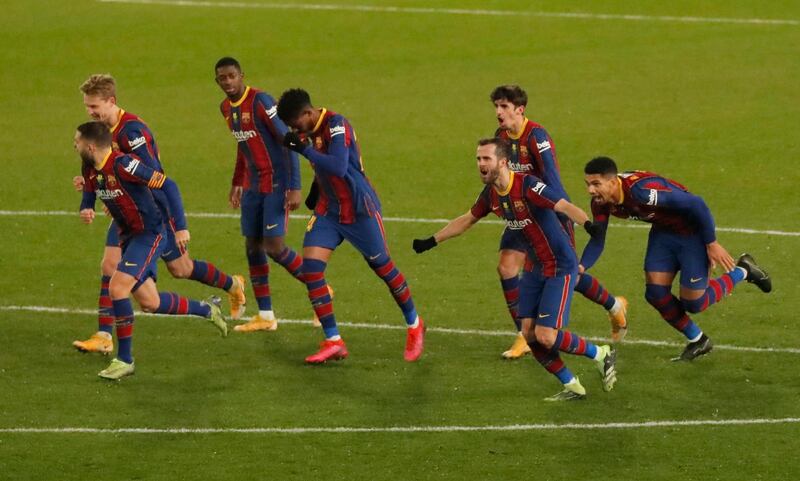 Barcelona players celebrate after winning the penalty shootout. Reuters