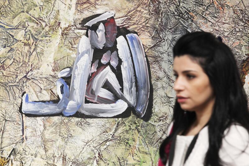 A woman walks past Egyptian artist Hamed Abdalla's 1978 work "Coma" at Art Dubai in Dubai. AP Photo