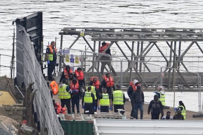 A group of people thought to be migrants are brought to Dover, Kent, on Tuesday. PA 