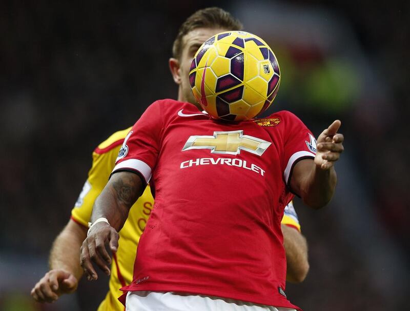 Manchester United's Ashley Young controls the ball with his chest during his side's Premier League victory on Sunday against Liverpool. Phil Noble / Reuters