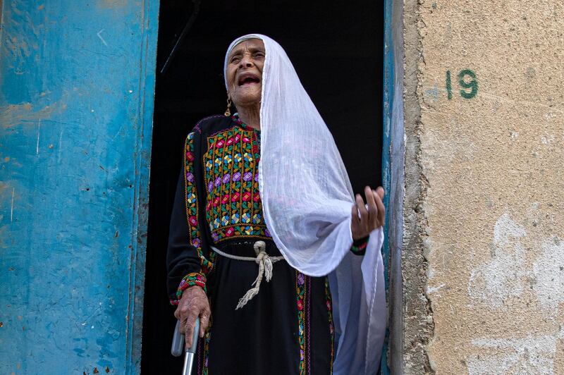 About  ninety years old Palestinian refugee Halima Abdehadi Mhamed, gestures as she speaks to the journalist at her house door, in the Baqa'a Palestinian refugee urban camp, near Amman, Jordan. She is originally from Dhekrein near Hebron in what used to be Palestine, she left her village with her family to flee violence first in 1948 then moved again three times more, always further towards Jordan, until they reached the Baqa'a Palestinian refugee urban camp after the 1967 flair of violence. She worked as a farmer and has no direct family. The World Refugee Day is marked on 20 June. World Refugee Day is marked annually on 20 June. According to the UNHCR, more and more refugees today live in urban settings outside refugee camps. EPA