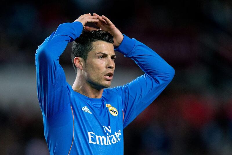 Cristiano Ronaldo of Real Madrid reacts as he fails to score during the Primera Liga match against Sevilla at Estadio Ramon Sanchez Pizjuan on March 26, 2014 in Seville, Spain. Gonzalo Arroyo Moreno / Getty Images