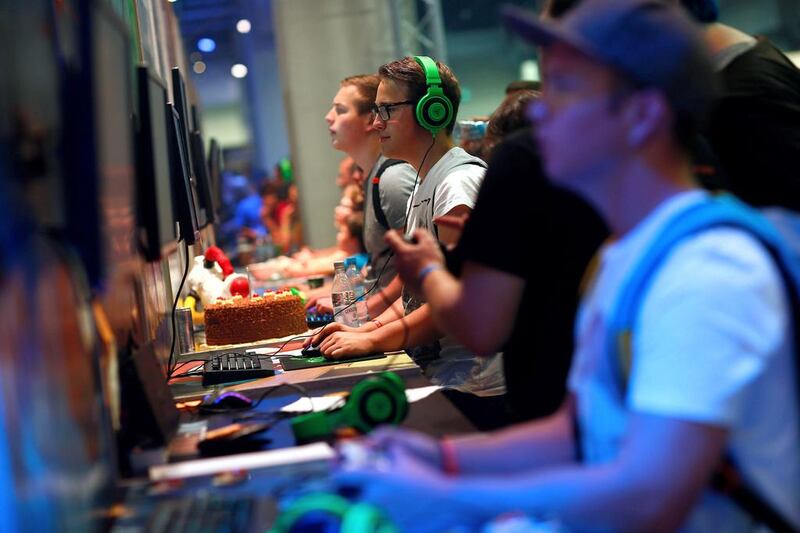 Visitors play the video game Superverse during the Gamescom fair. Ralph Orlowski / Reuters