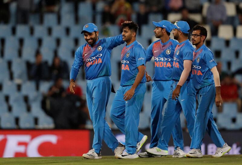 India's Rohit Sharma, left, congratulates India's bowler Jaydev Unadkat, second from left, after dismissing South Africa's batsman Reeza Hendricksâ€š for 26 runs during the second T20 cricket match between South Africa and India at Centurion Park in Pretoria, South Africa, Wednesday, Feb. 21, 2018. (AP Photo/Themba Hadebe)