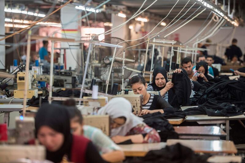 Egyptian tailors sew at the Marie Louis textile factory, about 60km north of Cairo.  AFP