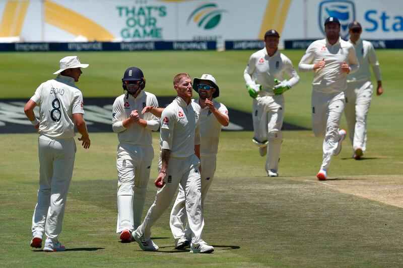 England's Ben Stokes, third left, celebrates with teammates after the dismissal of South Africa opener Dean Elgar. AFP