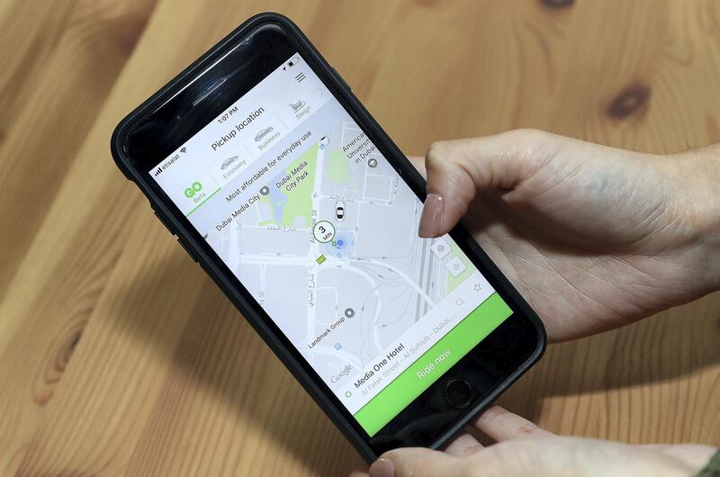 DUBAI , UNITED ARAB EMIRATES , DEC 19  – 2017 :- One of the employee showing the Careem taxi app at the Careem’s office at Dubai Media City in Dubai.  (Pawan Singh / The National) Story by Caline