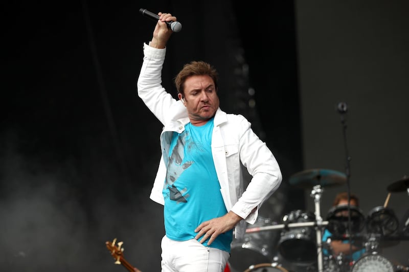 SINGAPORE - SEPTEMBER 17:  In this handout photo provided by Singapore GP, Simon Le Bon of Duran Duran performs on stage during day four of the Singapore Formula One Grand Prix at Marina Bay Street Circuit on September 17, 2017 in Singapore.  (Photo by Brendon Thorne/Singapore GP via Getty Images)