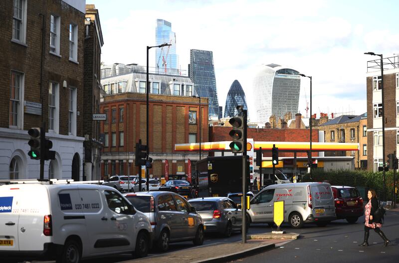Vehicles queue to fill up at a petrol station in central London. Photo: Reuters