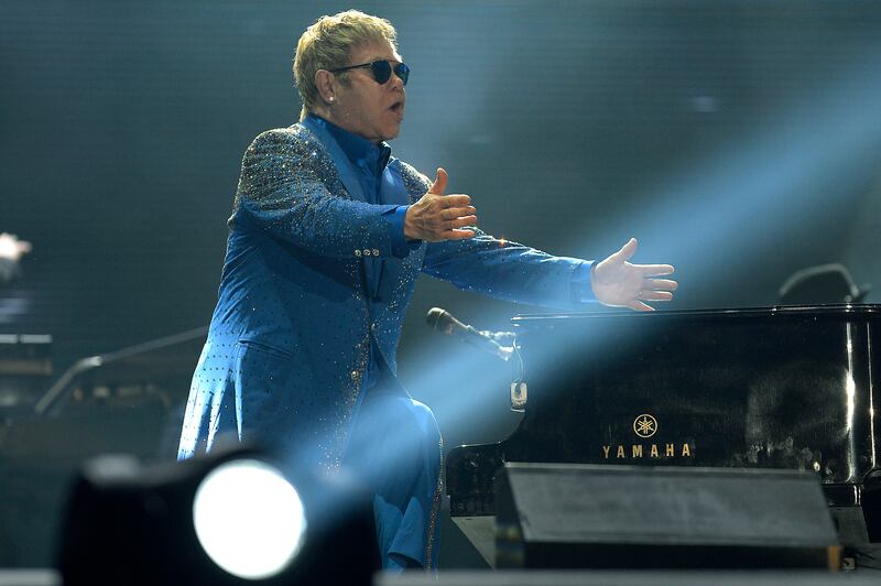 Elton John, in a blue suit with diamante detail, performs at 2015 Rock in Rio in Rio de Janeiro, Brazil on September 20, 2015. Getty Images