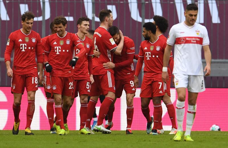 Bayern's Polish forward Robert Lewandowski celebrates scoring his team's fourth goal with teammates. AFP