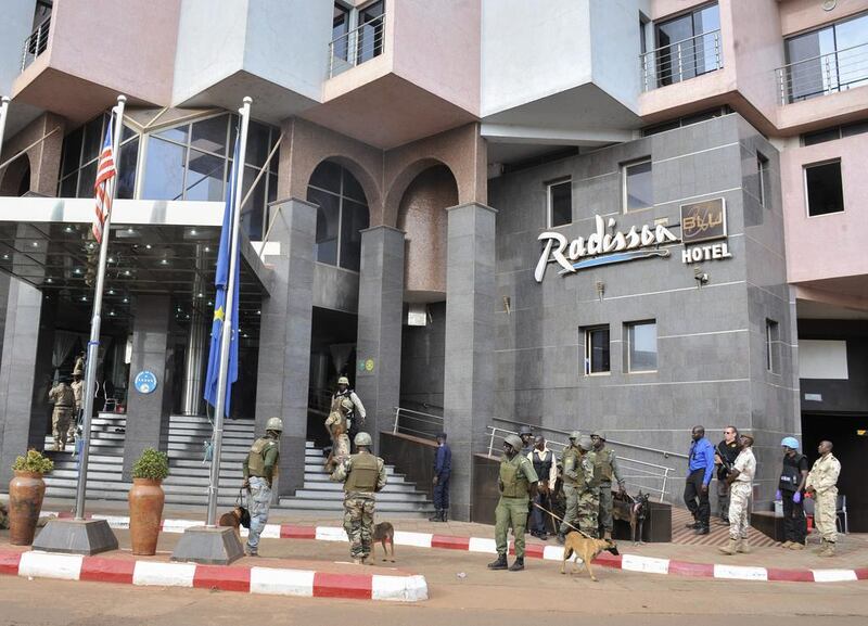 Security forces surround the Radisson Blu Hotel during a hostage situation in Bamako, Mali.  EPA/STR