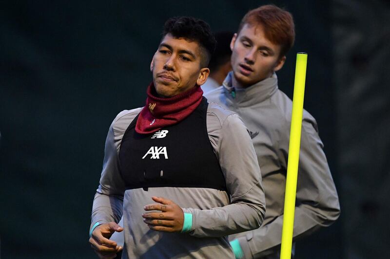 Liverpool's Brazilian midfielder Roberto Firmino, left, at Melwood. AFP