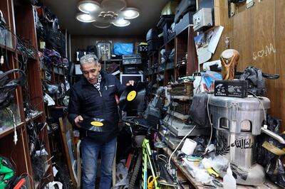 Hemmou runs the only store in Nablus repairing and selling vinyl records and their players. AFP