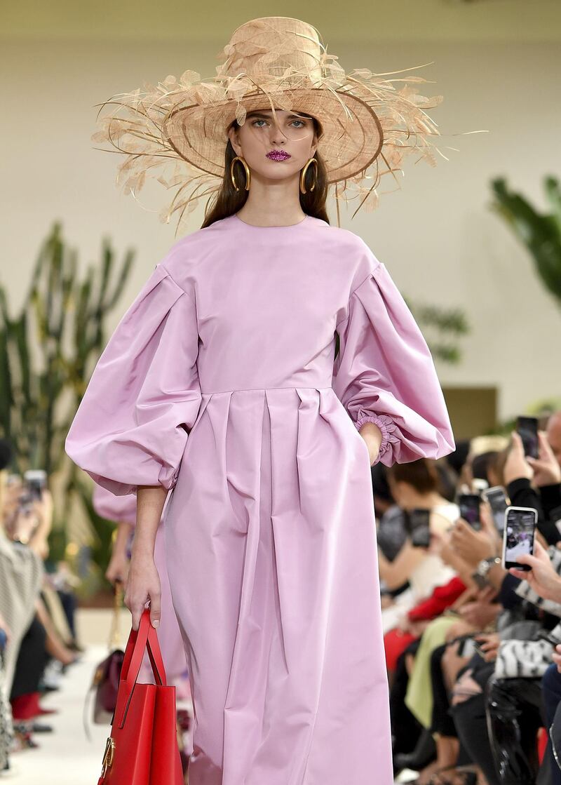 Showing its feminine side, Valentino's take on summery pastels included extra wide rimmed hats. Getty Images