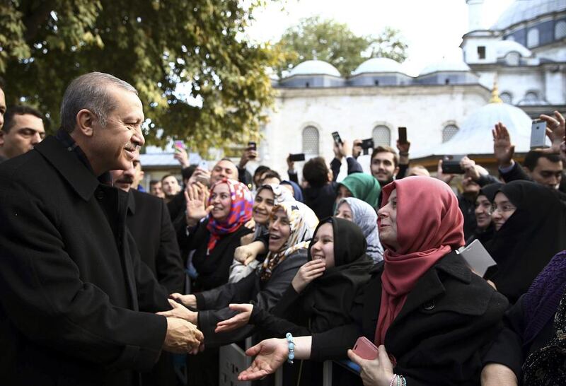 Turkey's president Recep Tayyip Erdogan speaks to supporters after morning prayers at Eyup Sultan Mosque in Istanbul. Presidential Press Service/ AP Photo