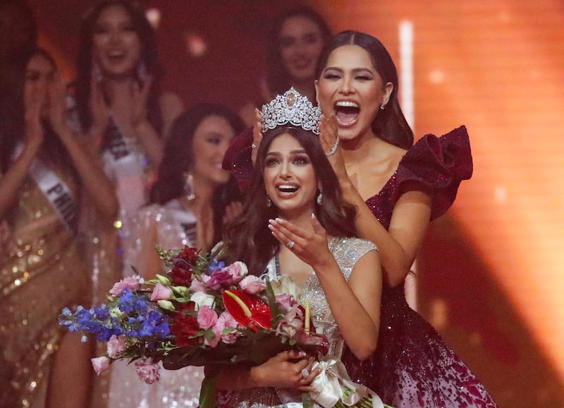 Miss Universe 2020, Andrea Meza, right, crowns India's Harnaaz Sandhu as Miss Universe 2021 during the 70th Miss Universe pageant in December. AP