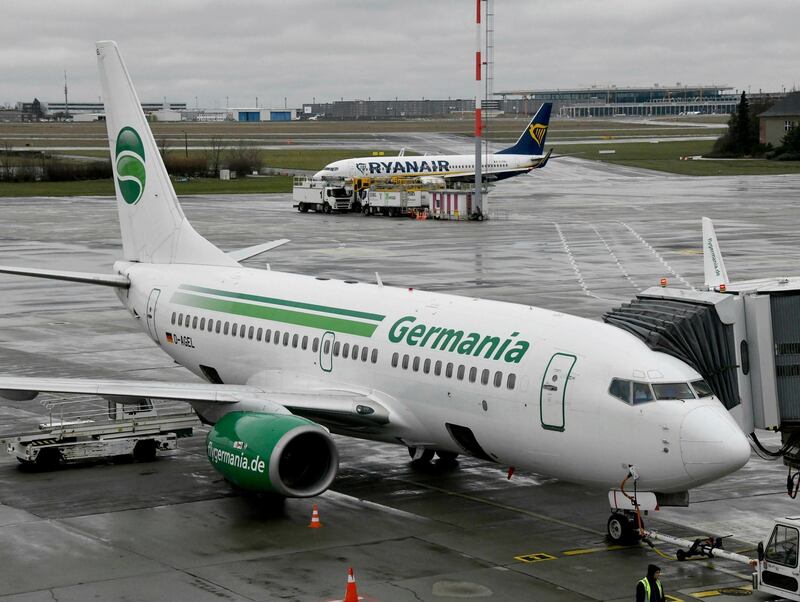 File--- In this picture taken Jan.9, 2019 an aircraft of German Germania airline is parked at Schoenefeld airport near Berlin. Germania has applied for insolvency. (Bernd Settnik/dpa via AP)