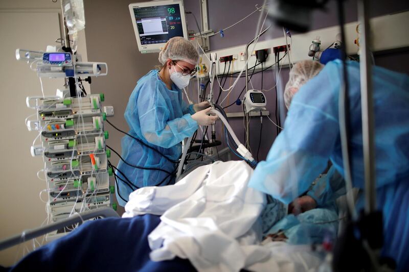 Medical staff members work in the Intensive Care Unit (ICU) where patients suffering from the coronavirus disease (COVID-19) are treated at the Melun-Senart hospital, near Paris, France, March 8, 2021. REUTERS/Benoit Tessier