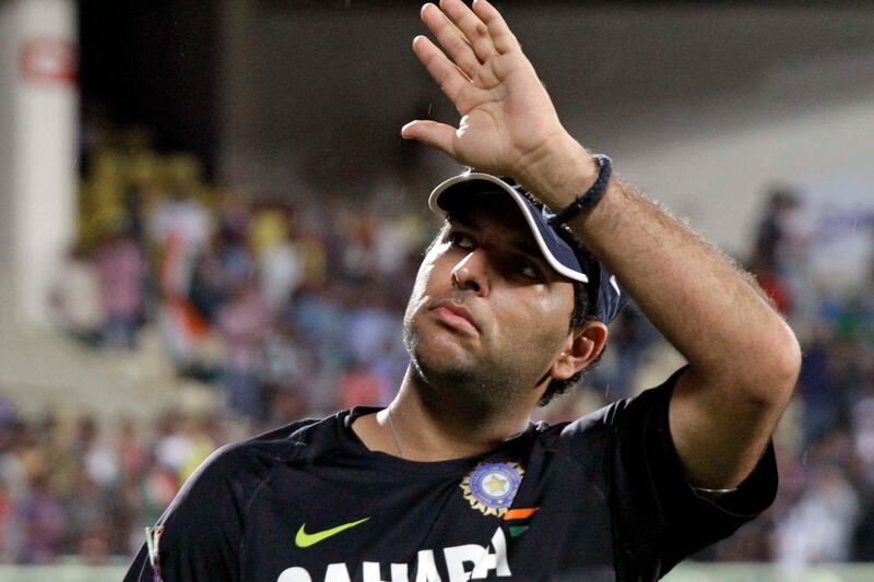 Indian cricketer Yuvraj Singh acknowledges the crowd as he takes a round in the stadium the day of the first Twenty20 cricket match against New Zealand in Visakhapatnam, India, Saturday, Sept. 8, 2012. Cancer survivor Singh’s return to international cricket was put on hold as the first Twenty20 game between India and New Zealand was washed out without a ball being bowled at Dr. Y.S. Rajasekhara Reddy Stadium on Saturday. (AP Photo/Bikas Das) *** Local Caption ***  India New Zealand Cricket.JPEG-02177.jpg