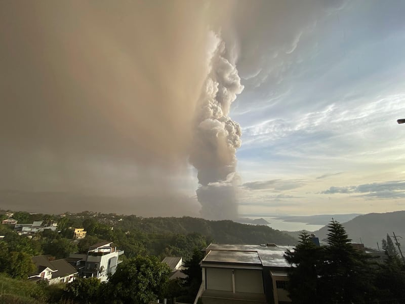 Plumes of smoke and ash rise from as Taal Volcano. AP