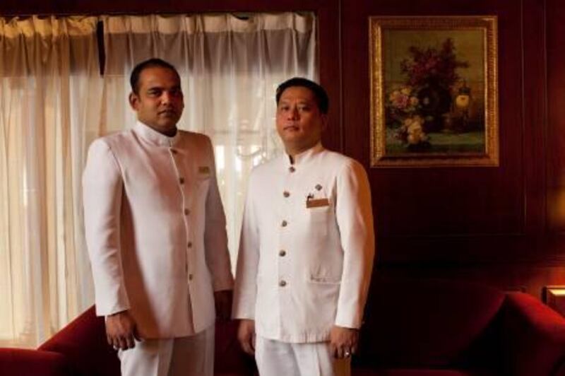 UAE - Dubai - Mar 14 - 2012: Concierges Nicholas Tolentino (right), from Philippines and Luis Holly Fernandes from India, pose for a portrait at the Metropolitan hotel.  ( Jaime Puebla / The National Newspaper )