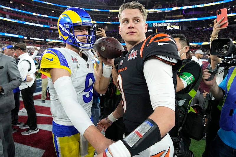 Los Angeles Rams quarterback Matthew Stafford, left, talks with Cincinnati Bengals quarterback Joe Burrow. AP Photo 