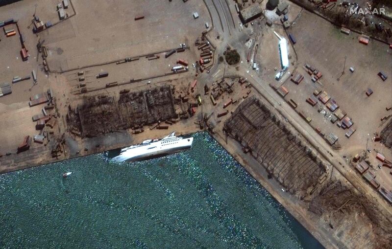 This August 5, 2020, handout satellite image obtained courtesy of  Maxar Technologies shows the capsized Orient Queen cruise ship after the explosion in Beirut on August 4, 2020. For at least six years, hundreds of tonnes of ammonium nitrate, which Lebanese authorities say caused Tuesday's massive blast, were negligently stored in a Beirut port warehouse, waiting for disaster to strike. The odourless crystalline substance commonly used as a fertiliser has caused numerous industrial explosions over the decades -- including the massive one in Beirut that killed at least 113 people, wounded thousands and left 300,000 homeless - RESTRICTED TO EDITORIAL USE - MANDATORY CREDIT "AFP PHOTO / Satellite image ©2020 Maxar Technologies " - NO MARKETING - NO ADVERTISING CAMPAIGNS - DISTRIBUTED AS A SERVICE TO CLIENTS
 / AFP / Satellite image ©2020 Maxar Technologies / Handout / RESTRICTED TO EDITORIAL USE - MANDATORY CREDIT "AFP PHOTO / Satellite image ©2020 Maxar Technologies " - NO MARKETING - NO ADVERTISING CAMPAIGNS - DISTRIBUTED AS A SERVICE TO CLIENTS
