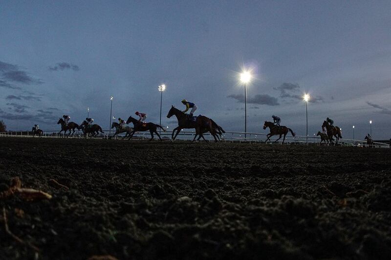 Runners ease down at the end of the Racing TV Apprentice Handicap - won by Kybosh - at Kempton Park Racecourse in England, on Wednesday, February 12. Getty