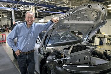 Peter Rawlinson, chief executive officer of Lucid Motors Inc., stands for a photograph next to the Lucid Air prototype electric vehicle at the company's headquarters in Newark, California. The company aims to produce 8,000 units of its new electric sedan next year. Bloomberg