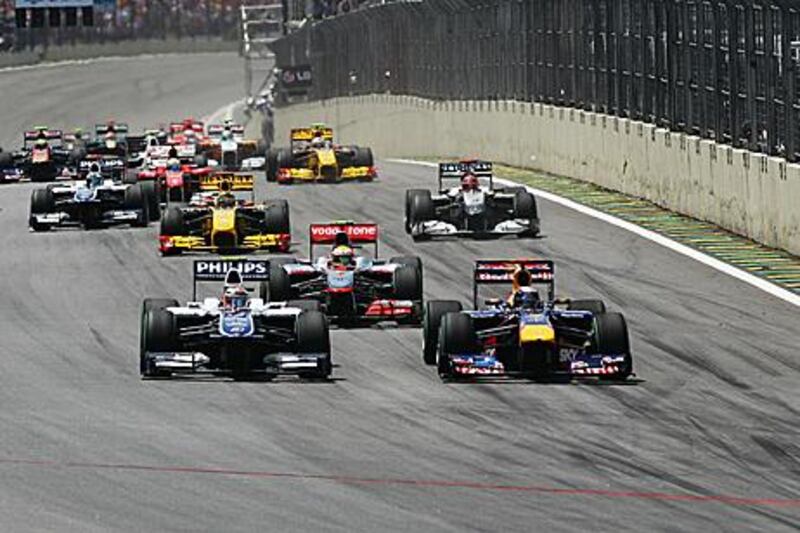 Sebastian Vettel, right, beats Nico Hulkenberg into the first turn at Interlagos before going on to win the Brazilian Grand Prix.