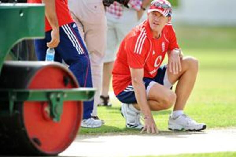 The England captain Andrew Strauss inspects the pitch during a practice session at the Sir Vivian Richards Cricket Ground ahead of the doomed second Test against the West Indies.