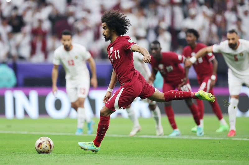 Akram Afif of Qatar scores his team's first goal from the penalty spot. Getty Images