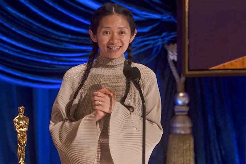 Chloe Zhao accepts the Oscar for Directing during the live ABC Telecast of The 93rd Oscars in Los Angeles, California, U.S., April 25, 2021. ABC/A.M.P.A.S./Handout via REUTERS ATTENTION EDITORS. THIS IMAGE HAS BEEN SUPPLIED BY A THIRD PARTY. NO MARKETING OR ADVERTISING IS PERMITTED WITHOUT THE PRIOR CONSENT OF A.M.P.A.S AND MUST BE DISTRIBUTED AS SUCH. MANDATORY CREDIT. NO RESALES. NO ARCHIVES. TABLOIDS OUT; NO BOOK PUBLISHING WITHOUT PRIOR APPROVAL.