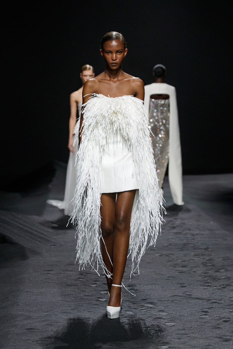 A tailored mini dress is framed with strips of leather at the Ashi Studio spring 2023 couture collection in Paris. 
Photo: Ashi Studio