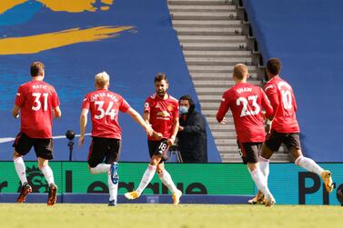 Soccer Football - Premier League - Brighton & Hove Albion v Manchester United - The American Express Community Stadium, Brighton, Britain - September 26, 2020 Manchester United's Bruno Fernandes celebrates scoring their third goal with teammates Pool via REUTERS/John Sibley EDITORIAL USE ONLY. No use with unauthorized audio, video, data, fixture lists, club/league logos or 'live' services. Online in-match use limited to 75 images, no video emulation. No use in betting, games or single club /league/player publications. Please contact your account representative for further details.